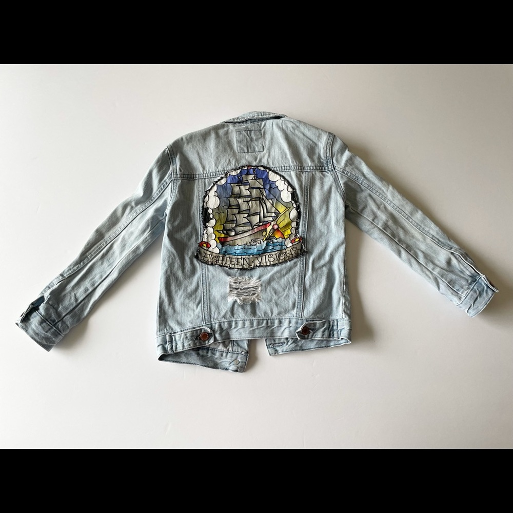 Distressed denim jacket with vintage band tee back detail: eighteen visions